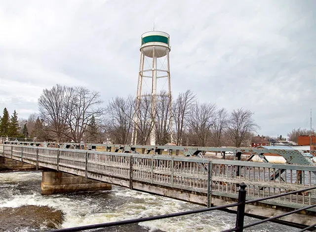 Confederation bridge, Smiths Falls with the white and green water tower in the background.